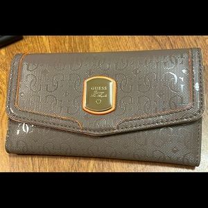 New Guess Multi Clutch Wallet Gray. New. Tiny bit of adhesive inside left corner